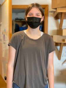 masked employee posing