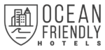 Logo of Ocean Friendly Hotels featuring a shield design with a cityscape and wave icon on the left, and the text "Ocean Friendly Hotels" on the right.