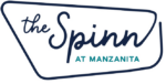 The image shows a logo with the words "the Spinn" in dark blue script and "AT MANZANITA" in teal uppercase letters, all enclosed by a single-line border forming an irregular geometric shape.